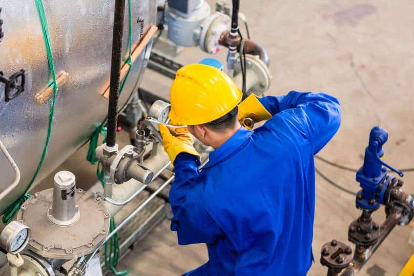 field service technician working on machine