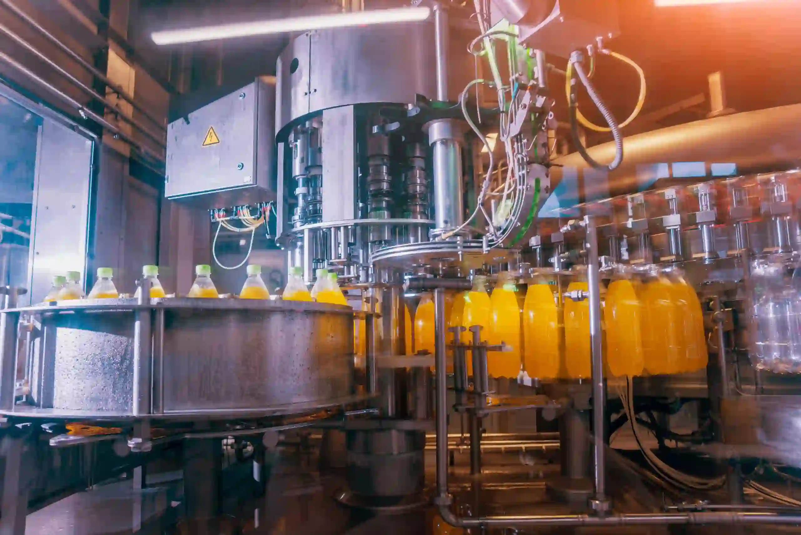 Beverages moving through an assembly line at a processing facility